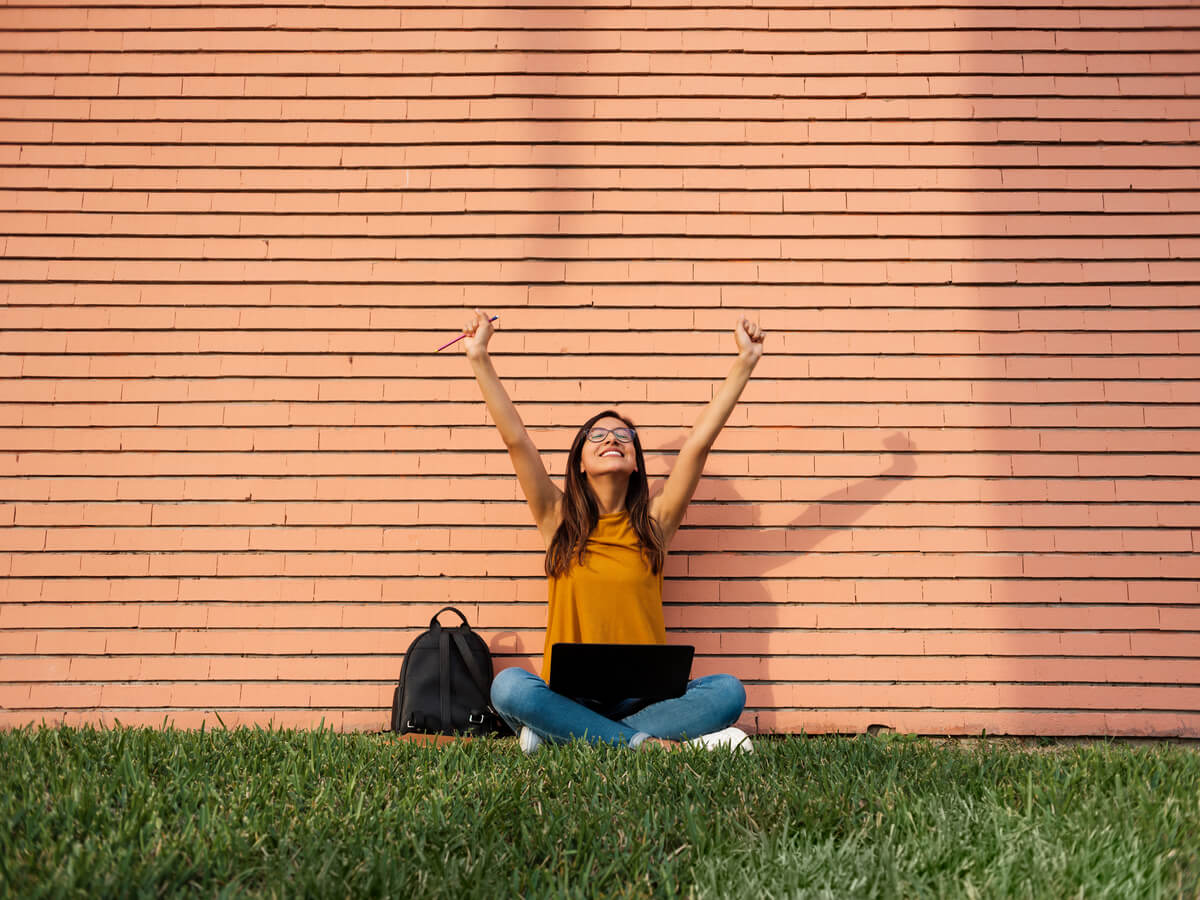 Woman excited after learning about consolidating her student loans.