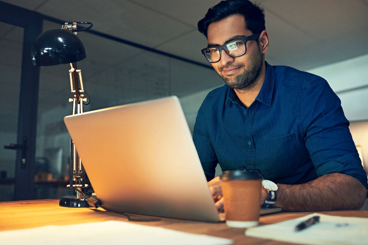 Man reading about how the stock market works